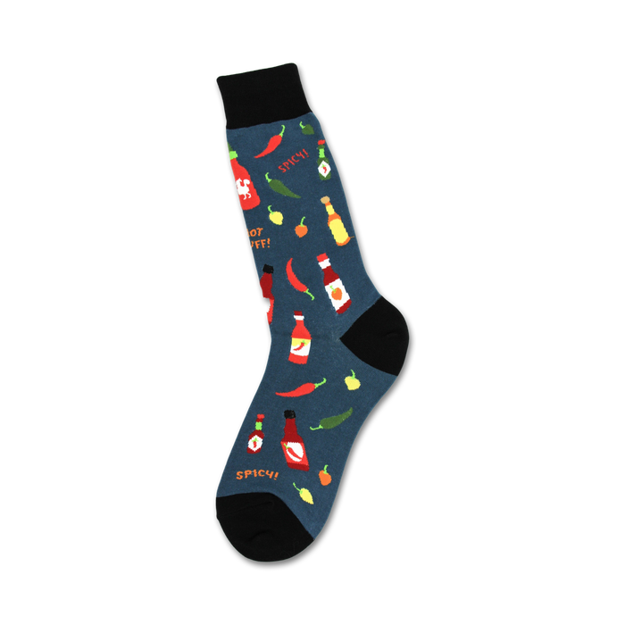 Crew socks in teal with a pattern of colorful hot sauce bottles, chili peppers, and jalapeños.  The words 'Spicy!' are also featured. }}