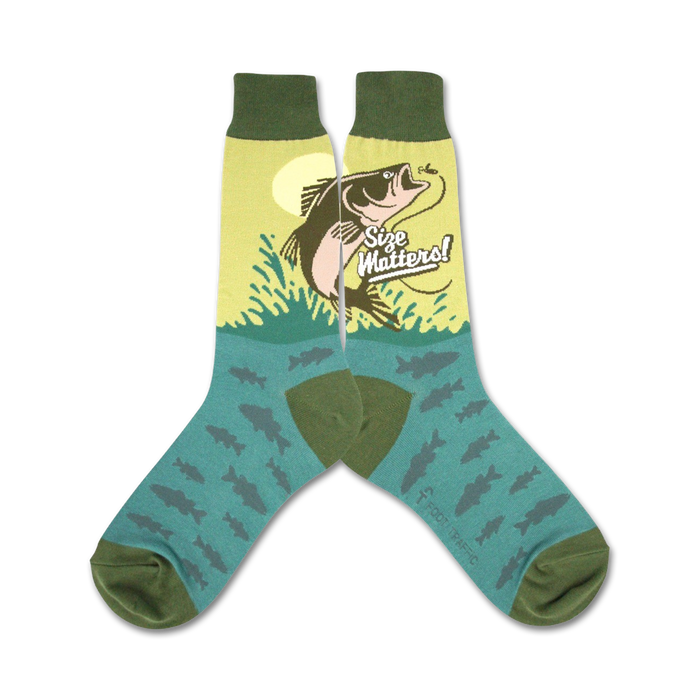 A pair of crew socks with a teal background. The socks feature a graphic of a large fish jumping out of the water with the text 'Size Matters!' Small fish are also printed on the socks. }}