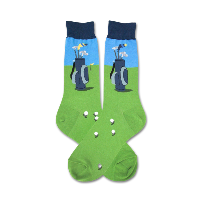 Pair of crew socks with a golf-themed design. The socks are green with a blue section showing golf clubs in a bag, and white golf balls are scattered on the green. }}