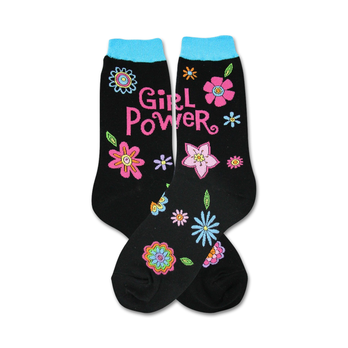 Pair of black crew socks with a teal cuff. Features a 'Girl Power' message and colorful flower designs. }}