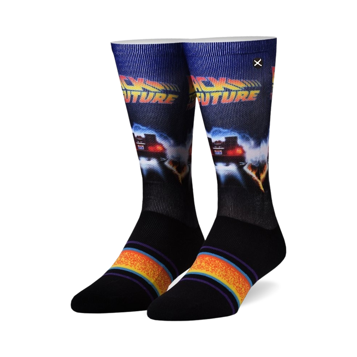 Pair of crew socks. Primarily black with a Back to the Future design featuring the DeLorean. Colorful stripes at the cuff.