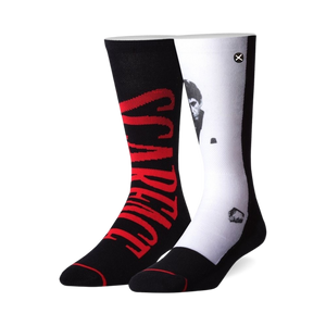 Pair of black and white crew socks. One sock features 'Scarface' in red, the other shows a black and white portrait of Al Pacino as Tony Montana.