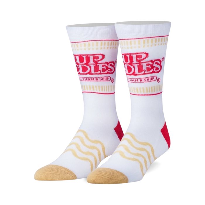 Pair of white crew socks with red Cup Noodles logo and wavy noodle pattern.  Features tan heel and toe. }}
