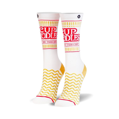 Pair of white crew socks with a Cup Noodles design. Red and yellow details feature the brand's logo and wavy noodle pattern.