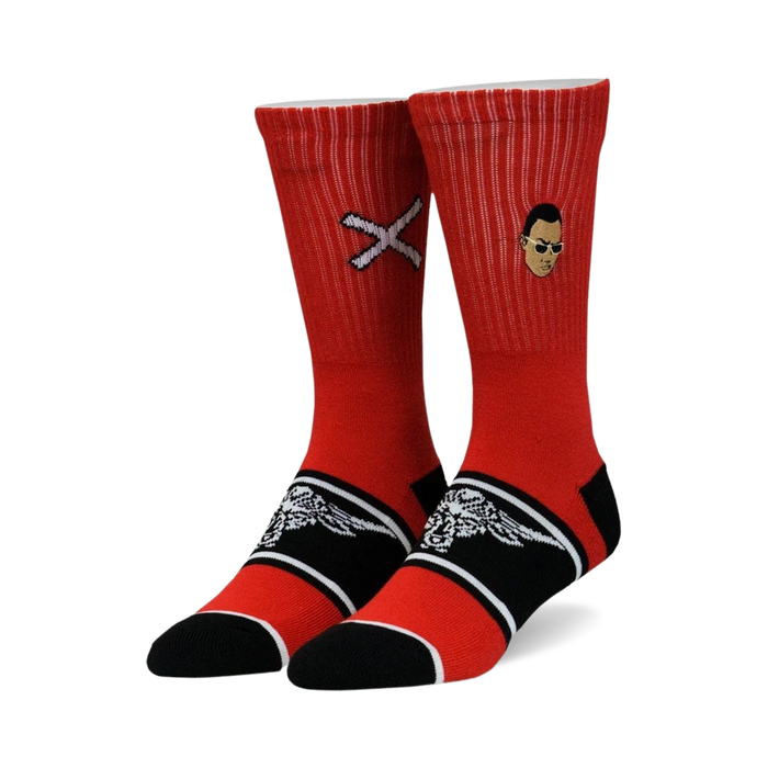 A pair of red crew socks with black and white accents. One sock features a small portrait, the other a white 'X'. }}