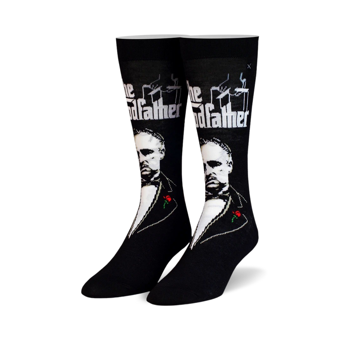Pair of black crew socks featuring a grayscale portrait of Marlon Brando as Don Vito Corleone from The Godfather, along with the film title and a small red rose. }}