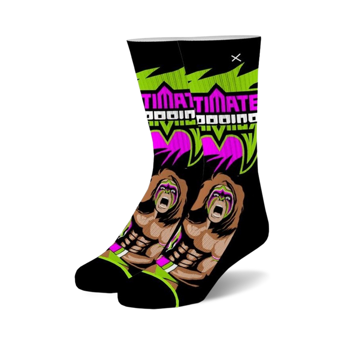black crew socks feature ultimate warrior, pro wrestler, with face paint and long hair. sock also has words 
