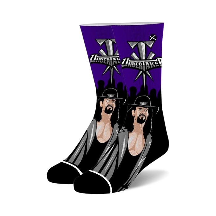 Pair of black and purple crew socks featuring The Undertaker's portrait and logo.  A must-have for wrestling fans! }}