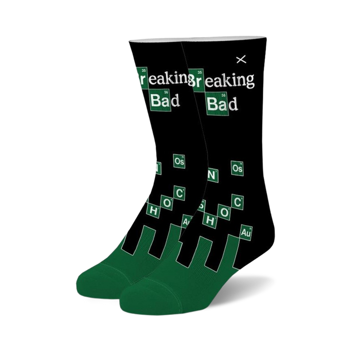 Pair of black crew socks with green accents.  Features the Breaking Bad logo and periodic table elements. }}