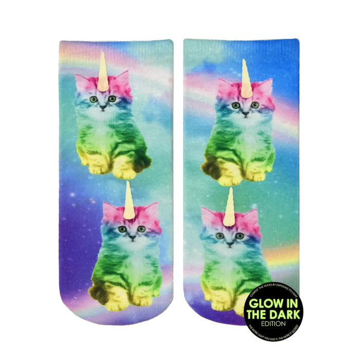 Crew socks featuring rainbow-colored unicorn kitties against a pastel galaxy print. The socks glow in the dark. }}