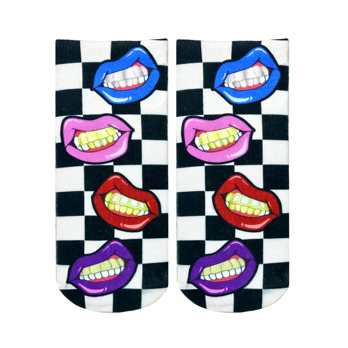 Ankle socks with a black and white checkered pattern and colorful lips with gold grillz. The lips are pink, purple, red, and blue. }}