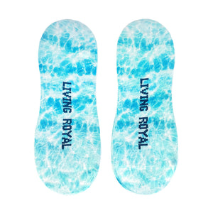 A pair of blue tie-dye socks with the words 