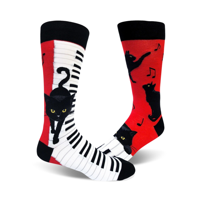 black, red, and white crew socks feature a pattern of cats playing pianos.    }}