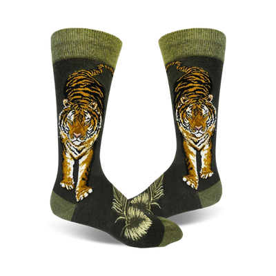 A pair of crew socks with a detailed tiger illustration in orange and black against a dark green background. The socks have a green cuff.