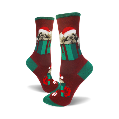 Crew socks in maroon, green, and red. Sloths wearing Santa hats are nestled inside green gift boxes.