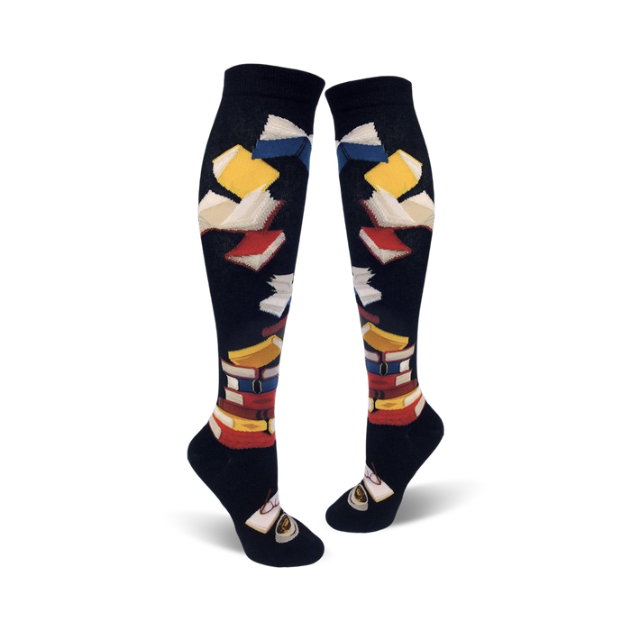 black knee-high socks with a pattern of colorful books, ribbed top, reinforced toe and heel.  