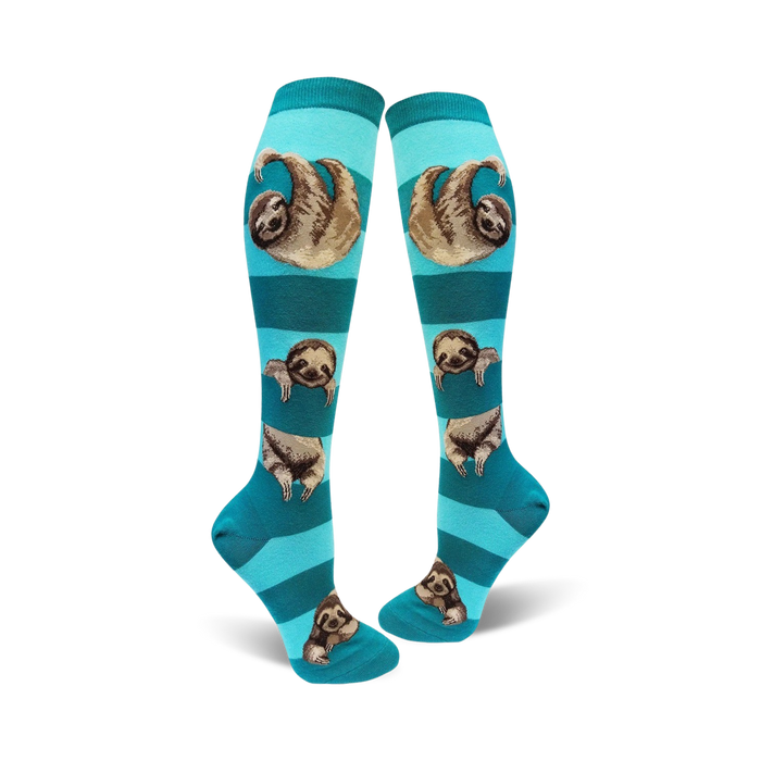 Pair of teal and navy blue striped knee-high socks with sloths printed on them. The sloths are hanging from the stripes.