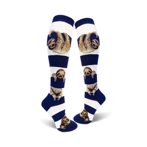 Lifestyle shot showing the model wearing the white and navy blue sloth stripe knee-high socks.