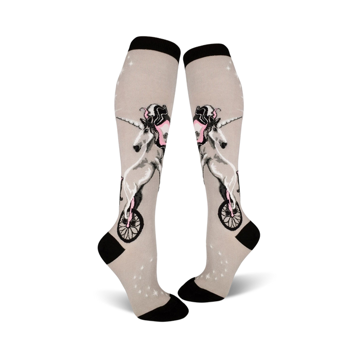gray knee high women's socks with unicycling unicorn pattern in pink and black.   }}