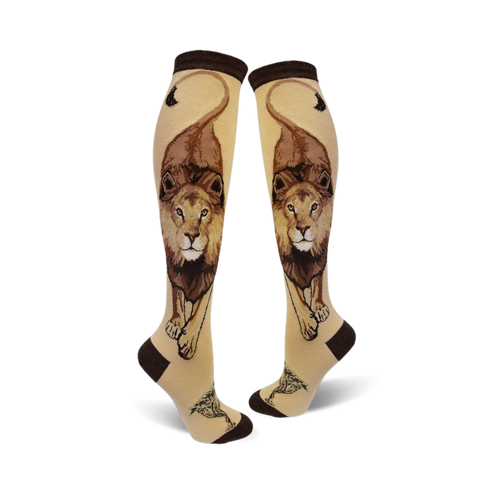 womens knee-high socks featuring a bold lion's face design in light tan and dark brown colors.   }}