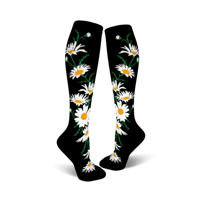 A pair of black knee-high socks with a whimsical pattern of white daisies and green stems.