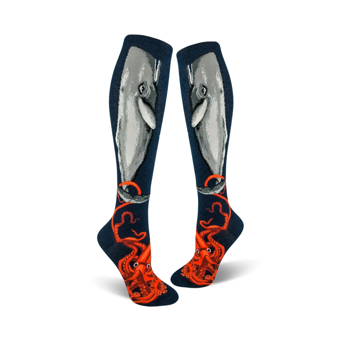 Pair of navy blue knee-high socks. A gray whale and an orange octopus are depicted on the socks. }}