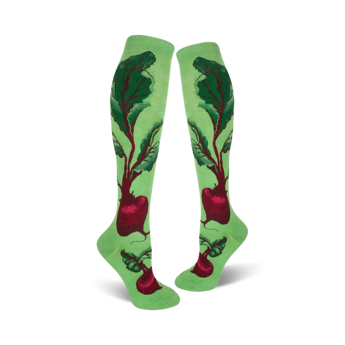 Pair of women's knee-high socks. Light green background with a whimsical beet and leaf design in deep reds and greens.