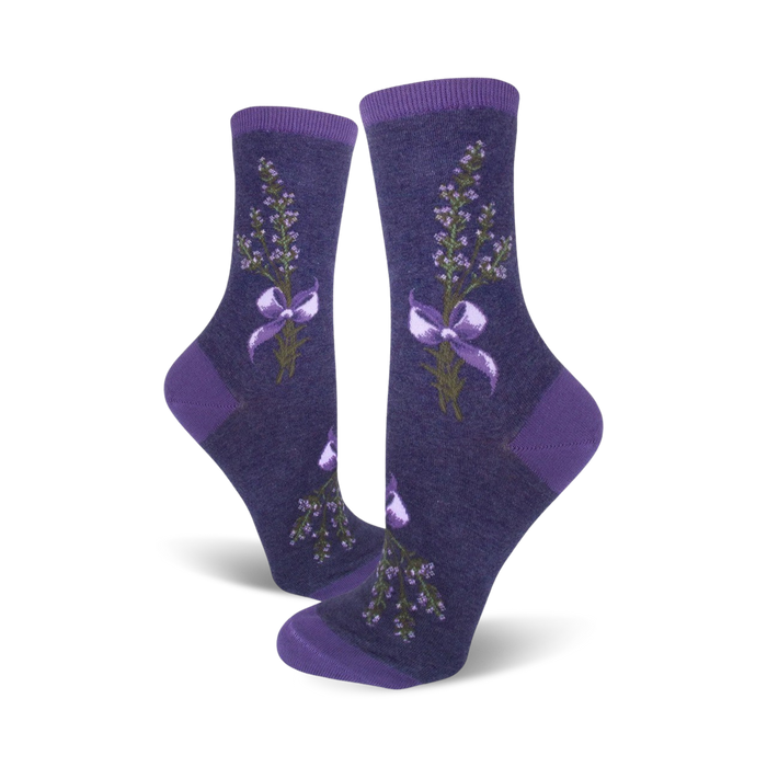 Pair of women's crew socks in shades of purple. Lavender sprigs tied with a bow are featured on a dark purple background. }}