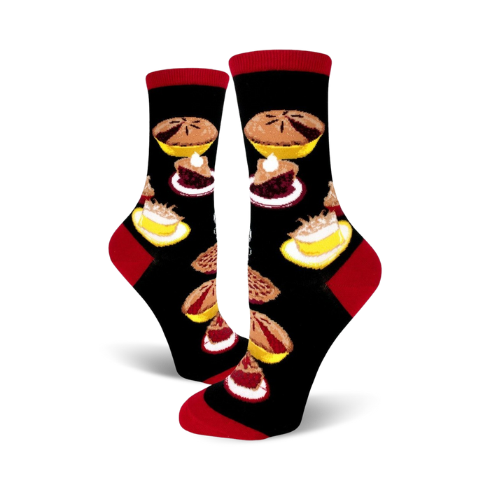 black crew socks with colorful pie patterns, featuring cherry, blueberry, and apple fillings. red toe and heel. women's size.   }}
