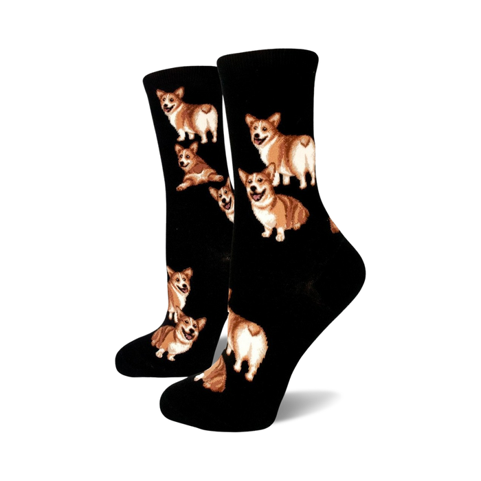 Pair of black crew socks adorned with multiple images of brown and white corgis in different poses, including some showcasing their fluffy butts. }}