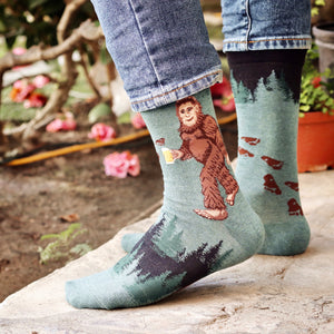 Lifestyle photo of a person wearing the Sasquatch Loves Beer socks, showcasing how they look when worn.