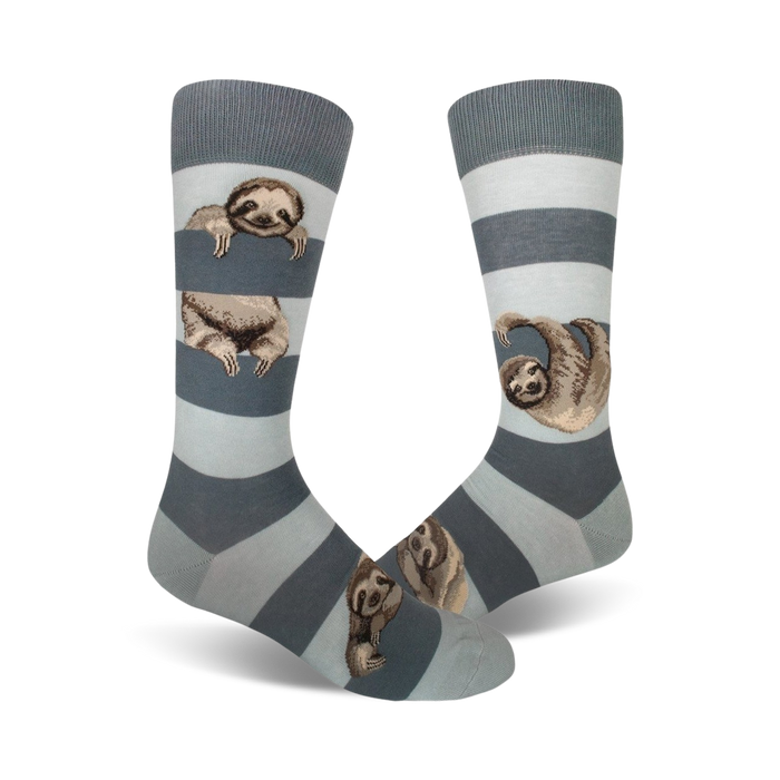 Pair of crew socks in blue and gray stripes.  Adorable sloths peek from behind the stripes.