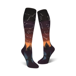 Lifestyle shot: A person's feet wearing the orange and purple Constellations socks with the design visible.