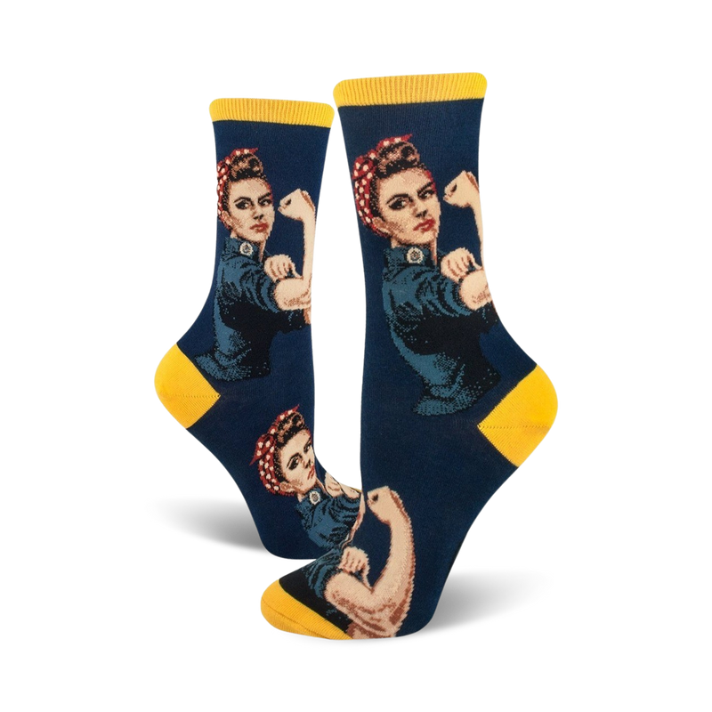 Crew socks in navy blue and yellow, featuring a Rosie the Riveter design. The iconic image shows Rosie flexing her bicep.