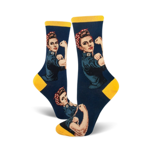Crew socks in navy blue and yellow, featuring a Rosie the Riveter design. The iconic image shows Rosie flexing her bicep.