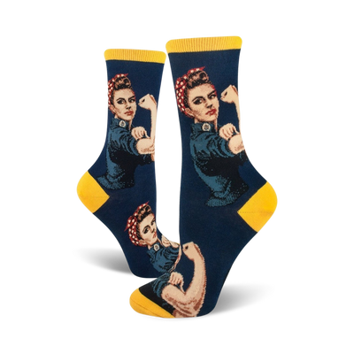 Crew socks in navy blue and yellow, featuring a Rosie the Riveter design. The iconic image shows Rosie flexing her bicep.