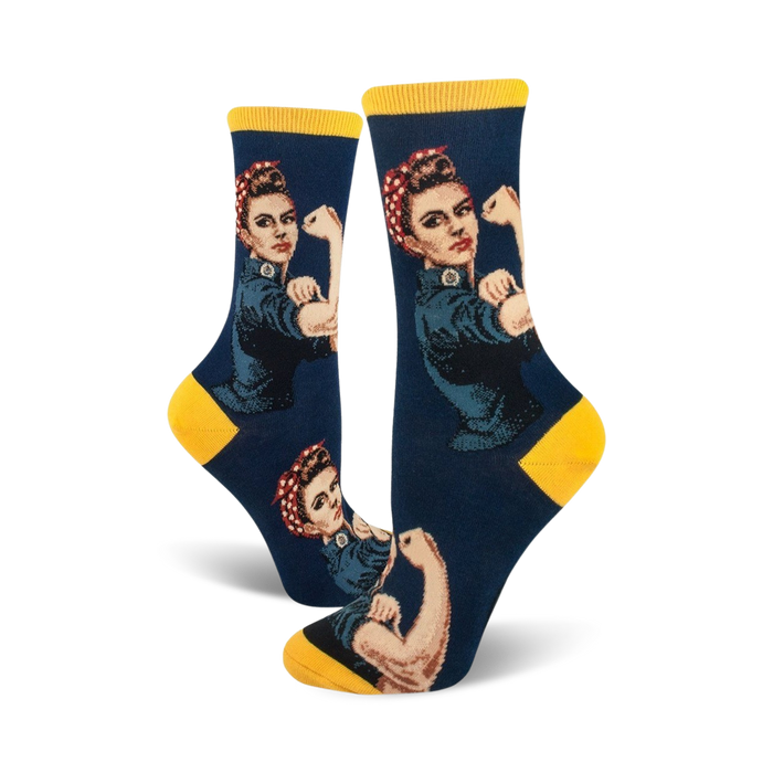 Crew socks in navy blue and yellow, featuring a Rosie the Riveter design. The iconic image shows Rosie flexing her bicep.
