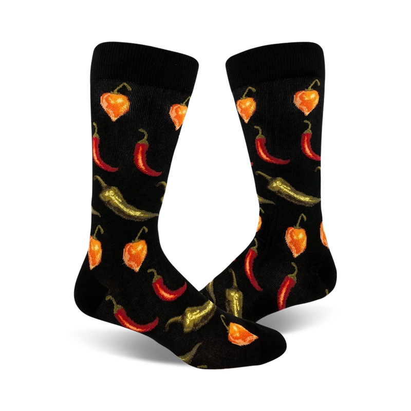 Pair of black crew socks with a fun pattern of red, orange, and green chili peppers of varying types.