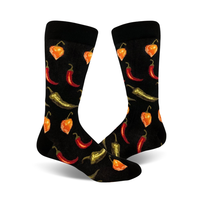 Pair of black crew socks with a fun pattern of red, orange, and green chili peppers of varying types. }}