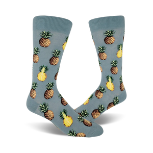 yellow pineapple pattern on light blue mens crew socks. pursuit of pineapples.  