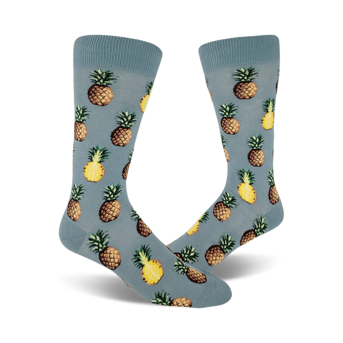 yellow pineapple pattern on light blue mens crew socks. pursuit of pineapples.  