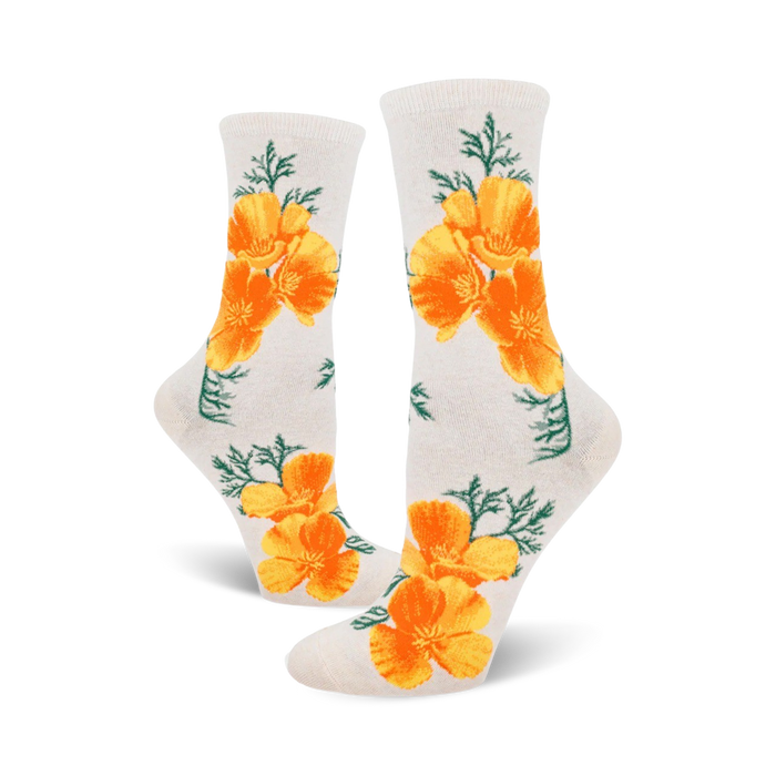 A pair of off-white crew socks featuring a repeating pattern of bright orange California poppies and green foliage. }}