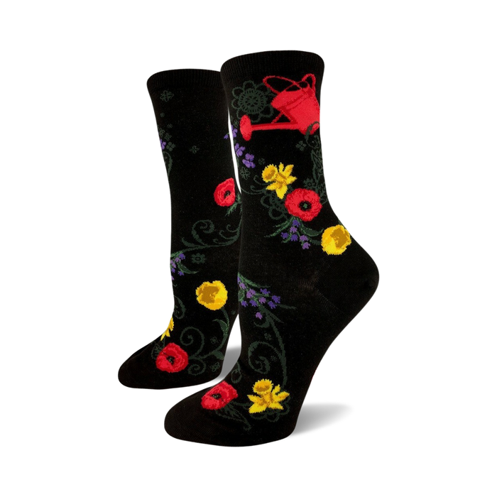 women's black crew socks feature red, yellow, and purple flowers and a red watering can pattern, perfect for the gardening enthusiast.    }}