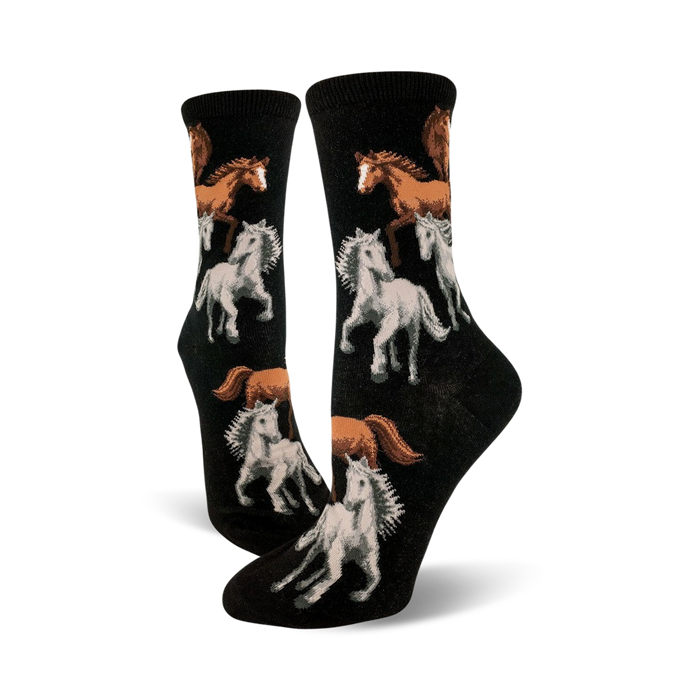black crew socks with white, brown, and tan cartoon horses running with flowing manes and tails.   }}