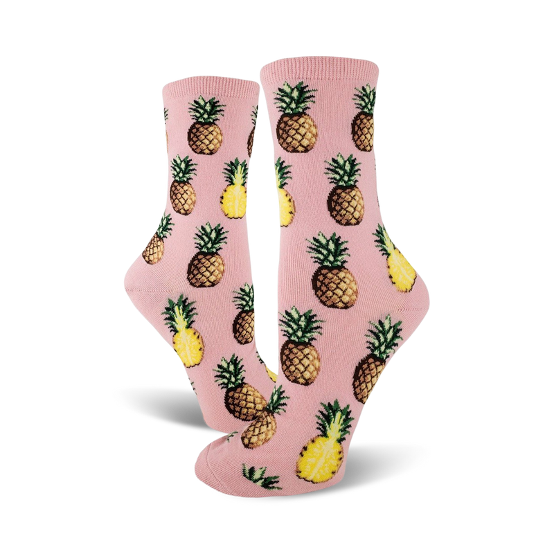 Pair of crew socks; pink and yellow pineapples on a pink background. Fun pineapple print socks.