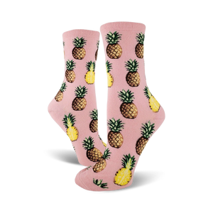 Pair of crew socks; pink and yellow pineapples on a pink background. Fun pineapple print socks.