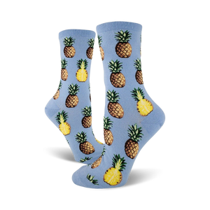 Close-up of light blue crew socks with a repeating pineapple pattern.