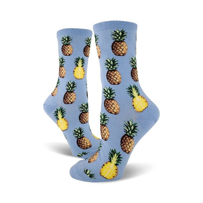 women's pursuit of pineapples novelty crew socks, yellow pineapple pattern on light blue   