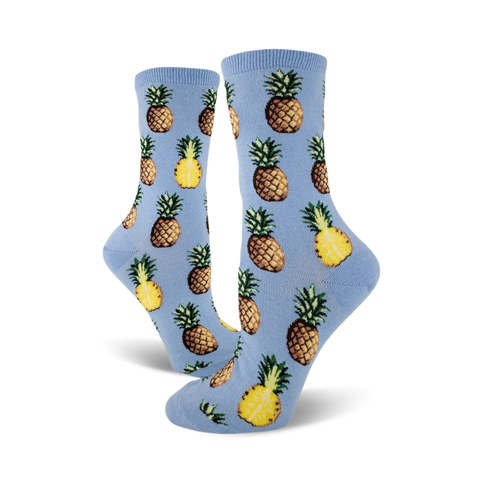 Close-up of light blue crew socks with a repeating pineapple pattern.