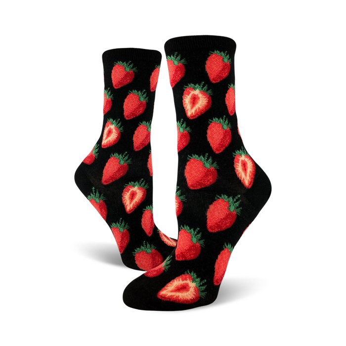 Close-up view of black crew socks with a red strawberry pattern. The socks are folded and displayed against a white background.